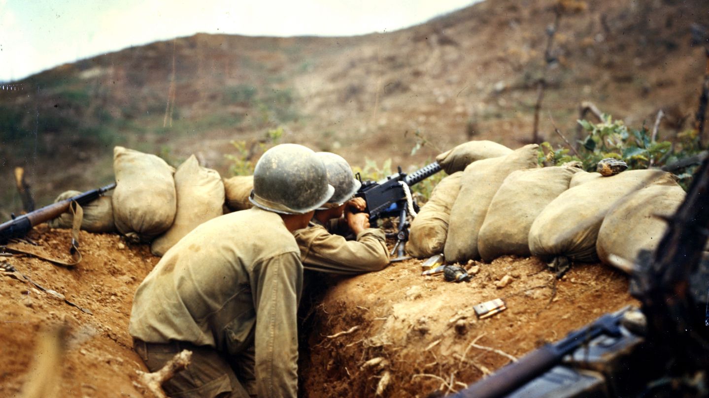 Two soldiers train their 30 caliber machine gun on Communist positions on the western front, during the Korean War, July 1952. (Photo by PhotoQuest/Getty Images)