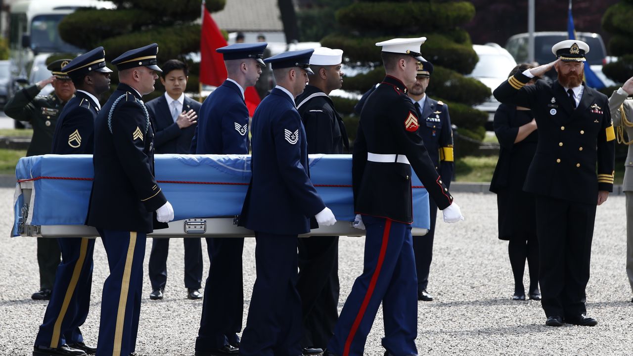 United Nations Command honor guards carry a casket containing the remains of a UNC soldier killed inside North Korea during the 1950-53 Korean War, during a joint repatriation ceremony at Knight Field at Yongsan garrison in Seoul on April 28, 2016. 