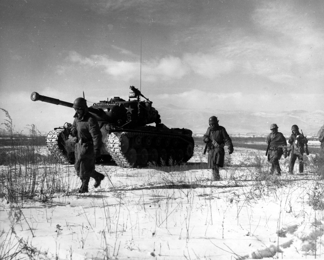 A column of troops and armor of the 1st Marine Division move through communist Chinese lines during their successful breakout from the Chosin Reservoir in North Korea. The Marines were besieged when the Chinese entered the Korean War Nov. 27, 1950, by sending 200,000 shock troops against Allied forces.