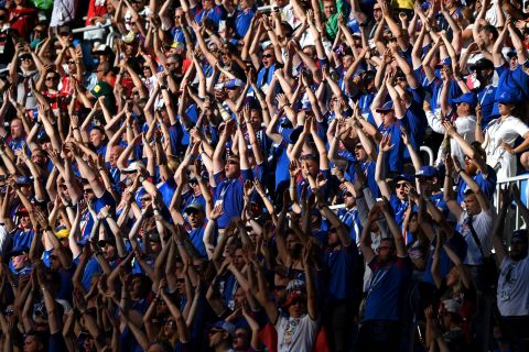 Iceland fans perform their famous viking clap.