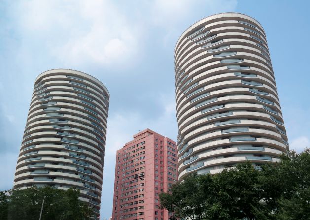 The city's more unusual structures would appear under the guidance of Kim Jong Il, who established his architectural credentials before his father's death in 1994. 