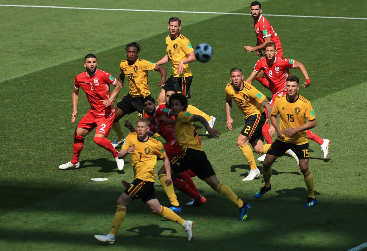 Players watch the ball during the Belgium-Tunisia match.