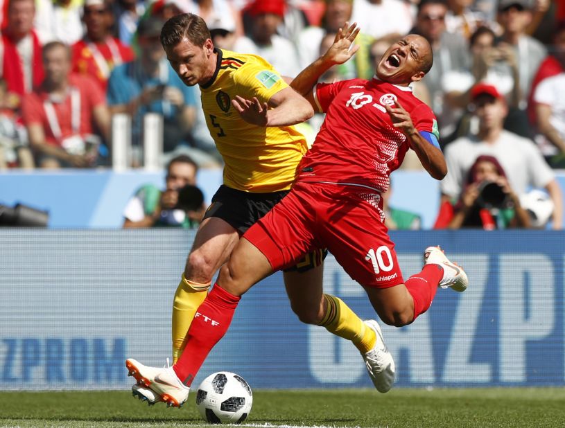 Belgium's Jan Vertonghen, left, challenges Tunisia's Wahbi Khazri.