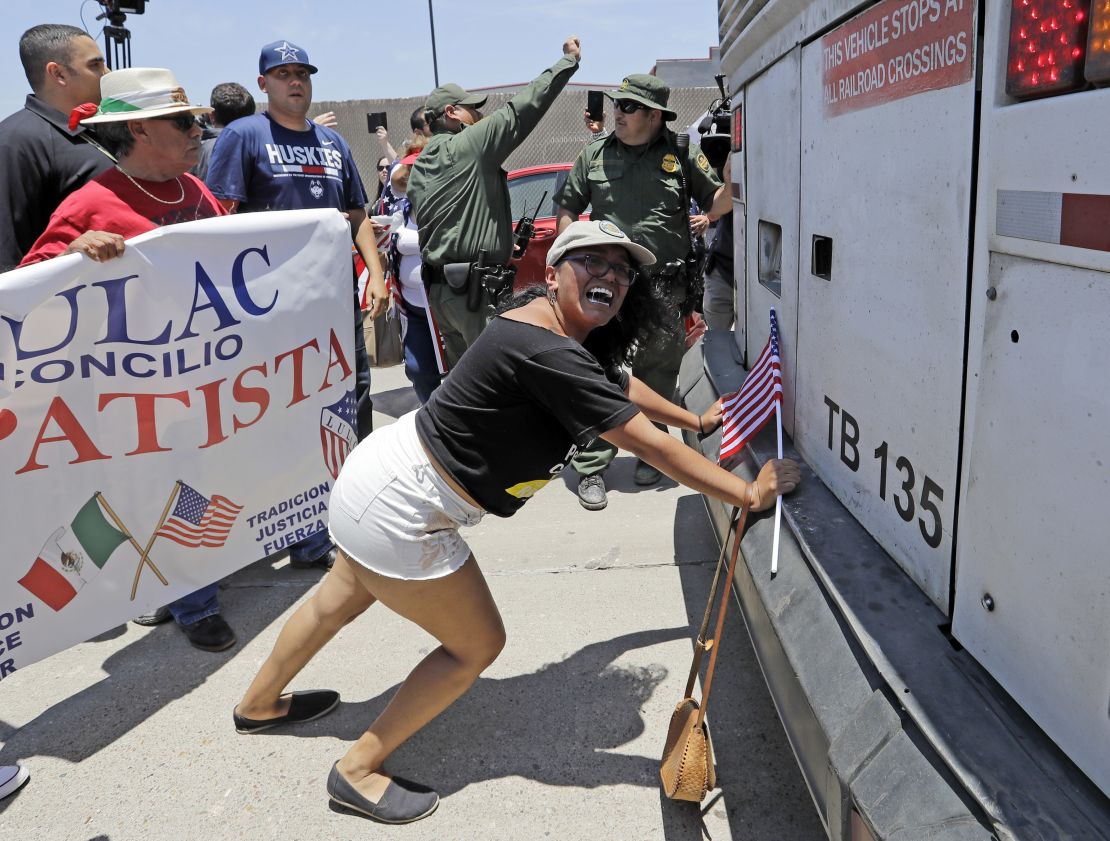 Demonstrator Martha Mercado tries to stop a bus with immigrant children onboard during a protest outside the U.S. Border Patrol Central Processing Center Saturday, June 23, 2018, in McAllen, Texas.