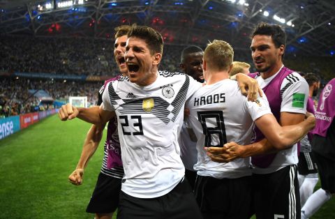 German players celebrate after Toni Kroos scored on a late free kick to stun Sweden 2-1 on June 23.