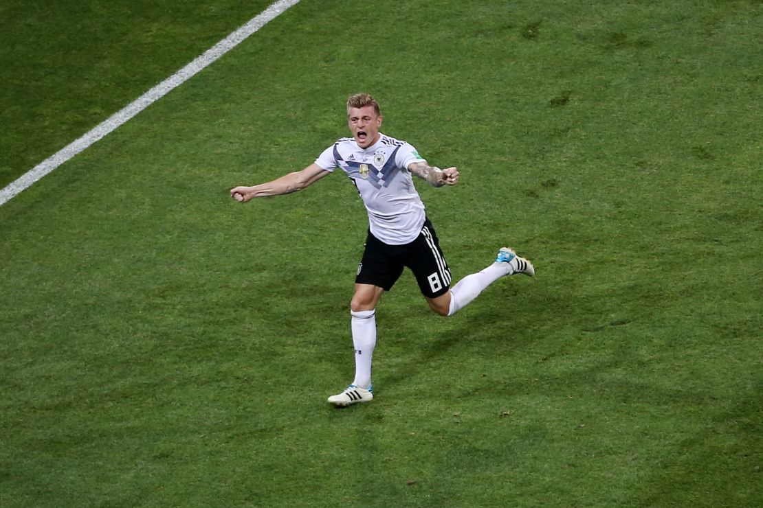 Toni Kroos celebrates a dramatic last-minute winner to save Germany's hopes.