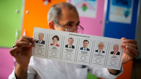A polling station worker holds a ballot in the mainly-Kurdish city of Diyarbakir in southeastern Turkey on Sunday.