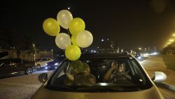 A Saudi woman and her friends celebrate her first time driving on a main street of Khobar City, Saudi Arabia on her way to Bahrain on June 24, 2018.