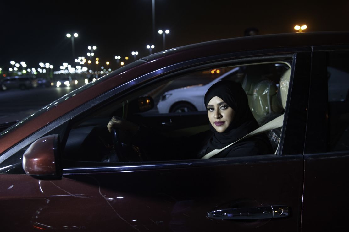 Saudi woman Sabika Habib drives her car through the streets of Khobar City on her way to Bahrain on Sunday.