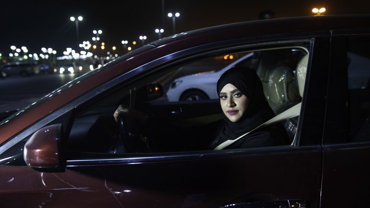 Saudi woman Sabika Habib drives her car through the streets of Khobar City on her way to Bahrain on Sunday.