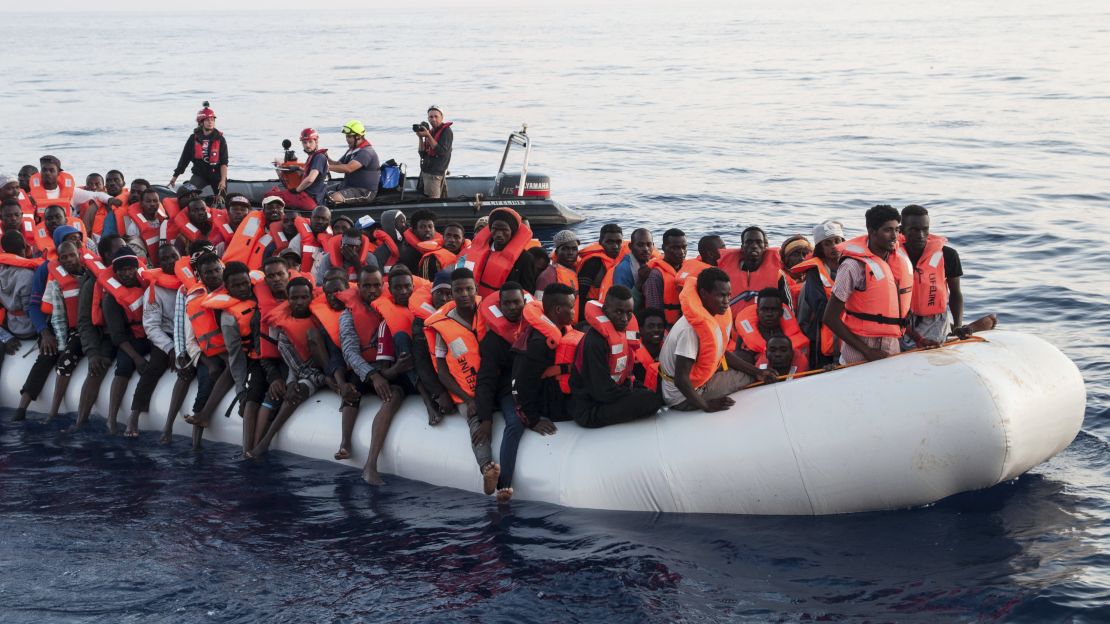 Migrants on a rubber boat are rescued by the Lifeline ship on Thursday.