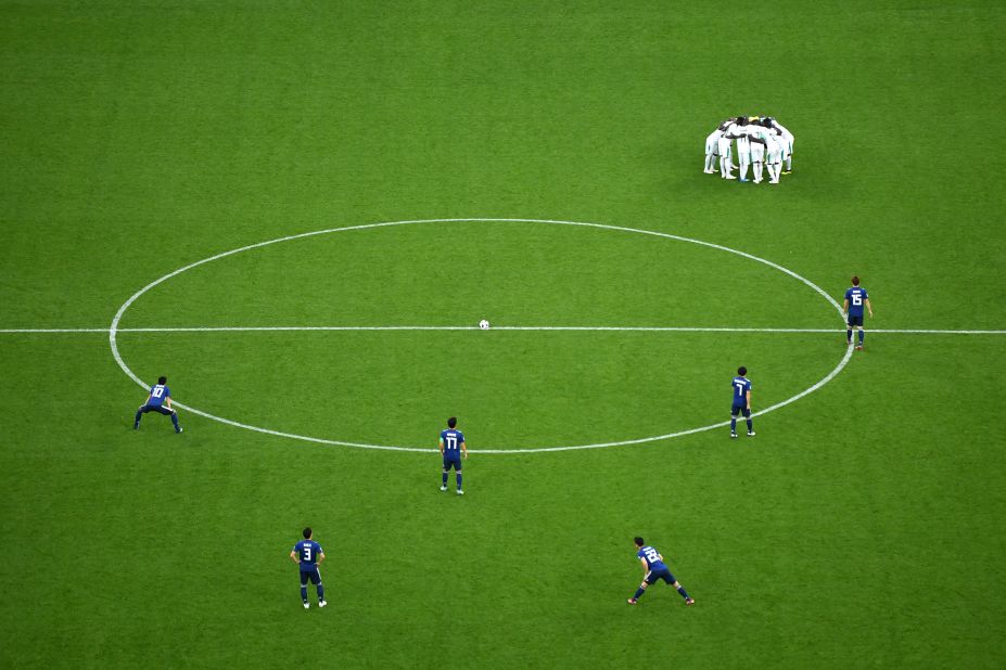 Senegalese players huddle up before the second half of their match against Japan on June 24. The two teams tied 2-2.