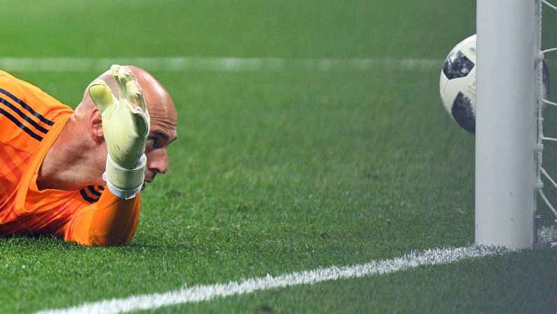 Argentina's goalkeeper Willy Caballero fails to save a goal by Croatia's midfielder Luka Modric during the match between Argentina and Croatia on Thursday, June 21. 