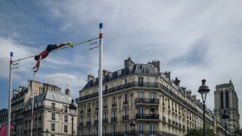 French pole vaulter Renaud  Lavillenie performs in front of the public on the Pont d'Arcole in the center of Paris on Saturday, June 23, during the "Olympics Day." The event was organized by the city of Paris to celebrate the 2024 Paris Olympics Games.
