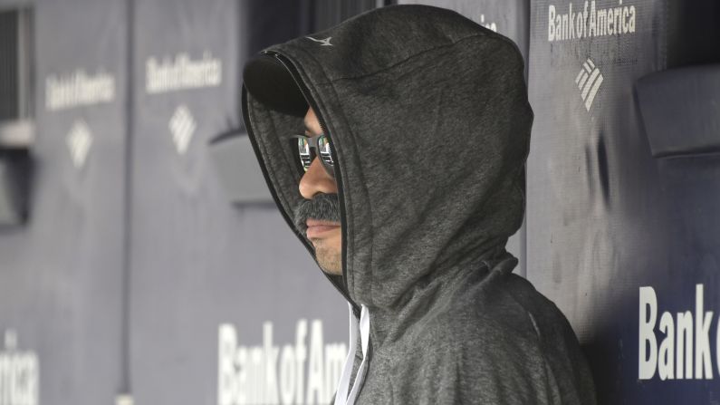 Ichiro Suzuki, now a special assistant to the chairman of the Seattle Mariners, wears a fake mustache and a hoodie as he sits in the dugout and watches the New York Yankees bat during the first inning on Thursday, June 21, at Yankee Stadium.