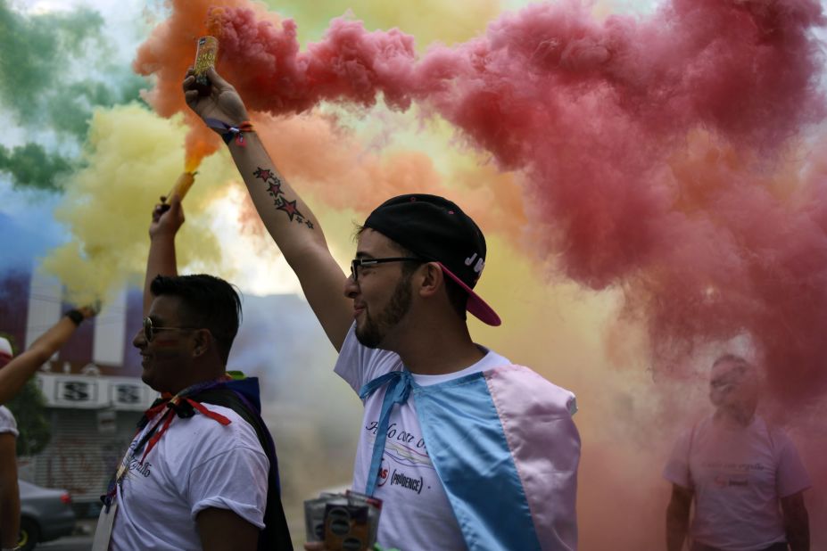 People take part in the Gay Pride Parade in Guatemala City, Guatemala, on Saturday.