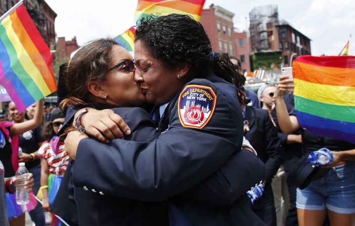 EMT Trudy Bermudez and paramedic Tayreen Bonilla of New York City Fire Department get engaged at the annual LGBT Pride March on Sunday, June 24. June is Pride Month, when the world's <a href="https://www.cnn.com/2018/06/13/health/pride-month-explainer-trnd/index.html">LGBT communities come together and celebrate</a> the freedom to be themselves.