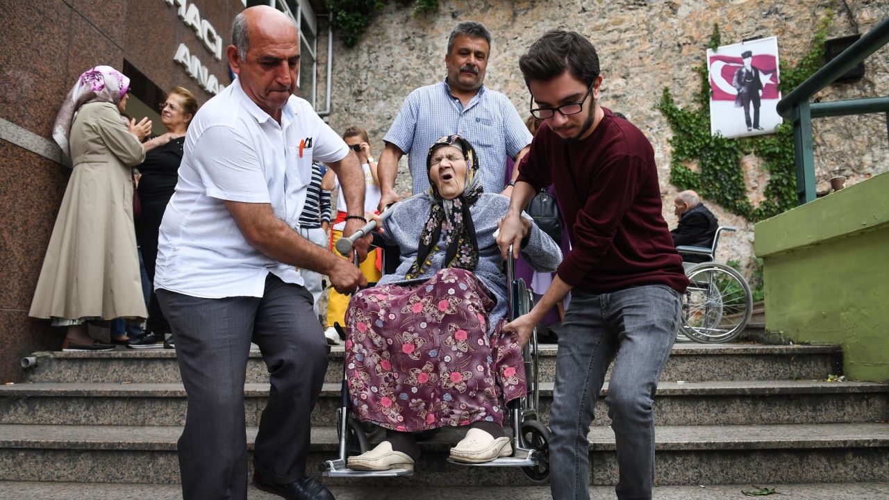 An elderly woman in a wheelchair leaving a polling station in Istanbul on Sunday.