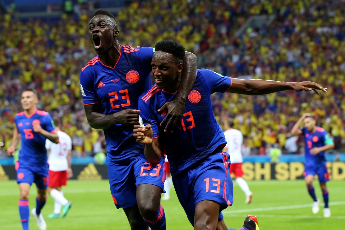 Yerry Mina of Colombia celebrates after scoring his team's first goal with Davinson Sanchez.