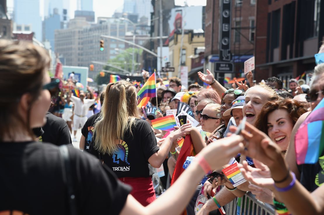 Volunteers join Trojan Condoms and Alexander Wang to celebrate the Protect Your Wang collaboration, supporing LGBTQ-inclusive sexual health programs, at the NYC Pride March on June 24, 2018 in New York City. Ilya S. Savenok/Getty Images for Trojan)