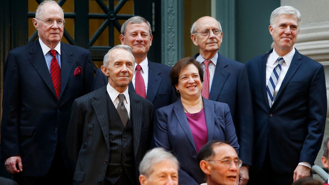 Several members of the Supreme Court pose for a portrait before taking part in a procession to mark Harvard Law School's bicentennial in October 2017. On the top row, from left, are Kennedy, Roberts, Breyer and Gorsuch. In front of them are Kagan and retired Supreme Court Justice David Souter.