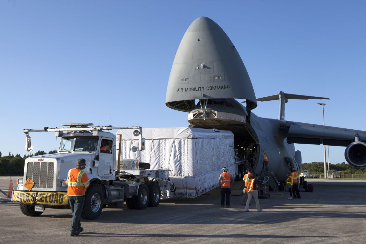 C-5s help NASA by transporting giant satellites to their launch sites for deliver into orbit. This GOES weather satellite is now circling the Earth, helping scientists learn more about the weather.