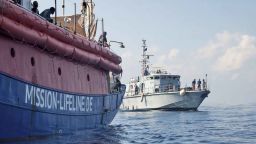 In this photo taken on Thursday, June 21, 2018, the ship operated by the German NGO Mission Lifeline is reached by a Libyan Coast Guard boat after they rescued migrants from a rubber boat in the Mediterranean Sea in front of the Libyan coast. Italy's interior minister says Malta should allow a Dutch-flagged rescue ship carrying 224 migrants to make port there because the ship is now in Maltese waters. Salvini said the rescue was in Libyan waters, which Lifeline denies. (Hermine Poschmann/Mission Lifeline via AP)