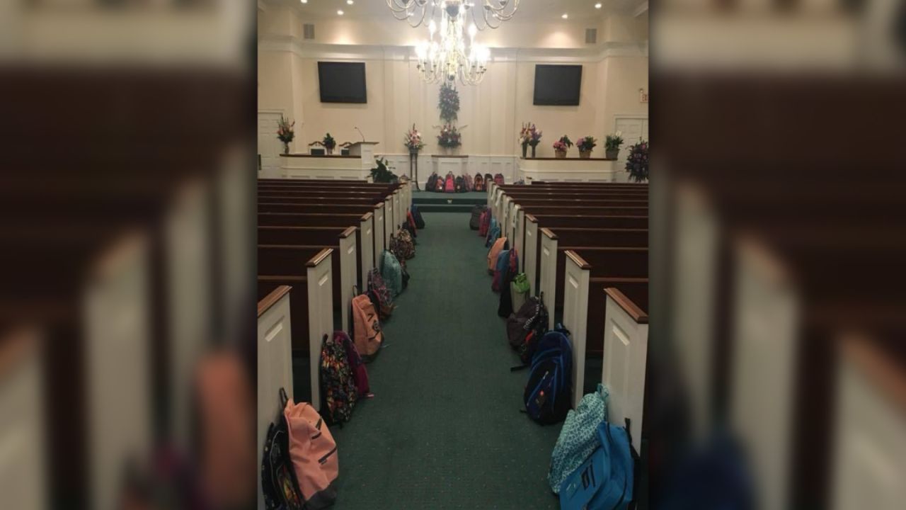 Backpacks line a church's aisle at the funeral for teacher Tammy Waddell.