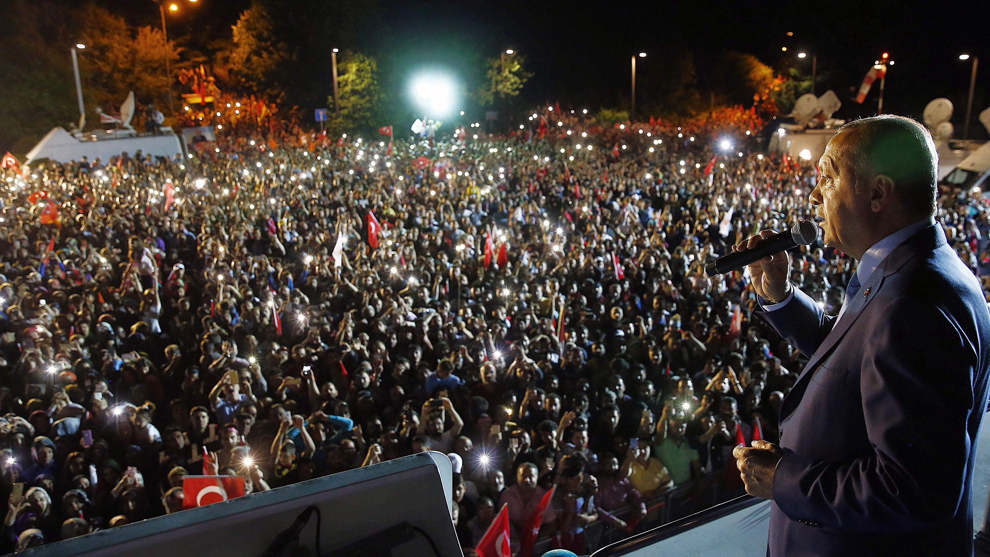 Turkey's President and leader of ruling Justice and Development Party (AKP) Recep Tayyip Erdogan addresses supporters.