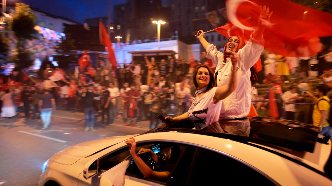 Supporters of Turkey's ruling Justice and Development Party, or AKP, leader, President Recep Tayyip Erdogan celebrate outside the party headquarters.