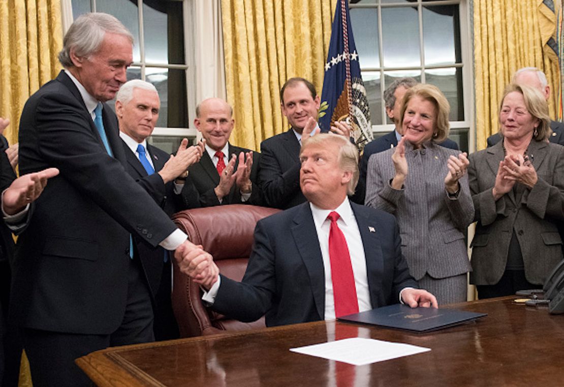 US President Donald Trump shakes hands with US Senator Ed Markey, after signing a bill intended to prevent the flow of opioids into the United States, January 10, 2018.