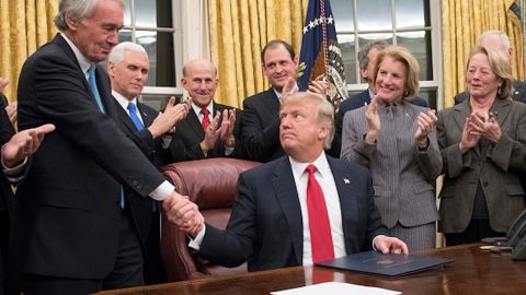 US President Donald Trump shakes hands with US Senator Ed Markey, after signing a bill intended to prevent the flow of opioids into the United States, January 10, 2018.