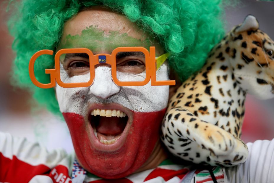 An Iran fan enjoys the pre-match atmosphere.