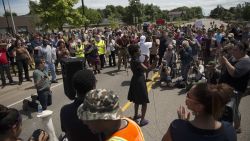 ST. ANTHONY, MN - JULY 10:  People demonstrate outside the St. Anthony Police Department on July 10, 2016 in St. Anthony, Minnesota. Protestors and activists have been staging rallies across the Twin Cities metro every day since police shot and killed Philando Castile. (Photo by Stephen Maturen/Getty Images)