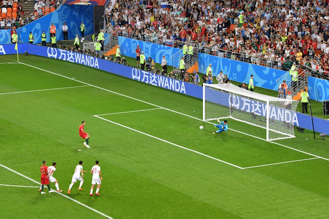 Ali Beiranvand of Iran saves Cristiano Ronaldo's penalty.