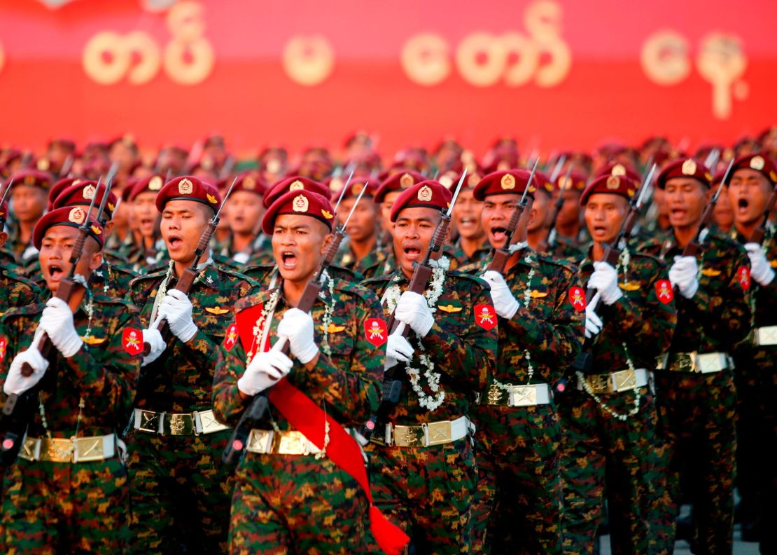 Myanmar soldiers march in formation during a military parade in Naypyidaw on March 27, 2018.