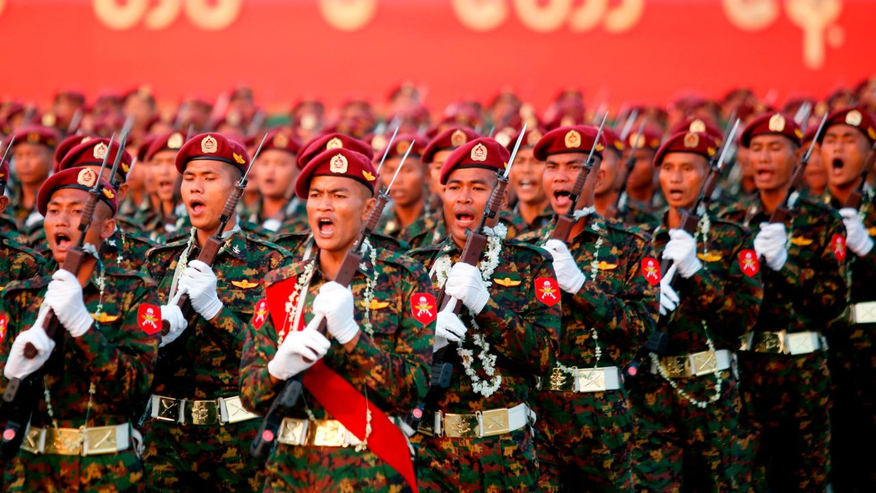 Myanmar soldiers march in formation during a military parade in Naypyidaw on March 27, 2018.