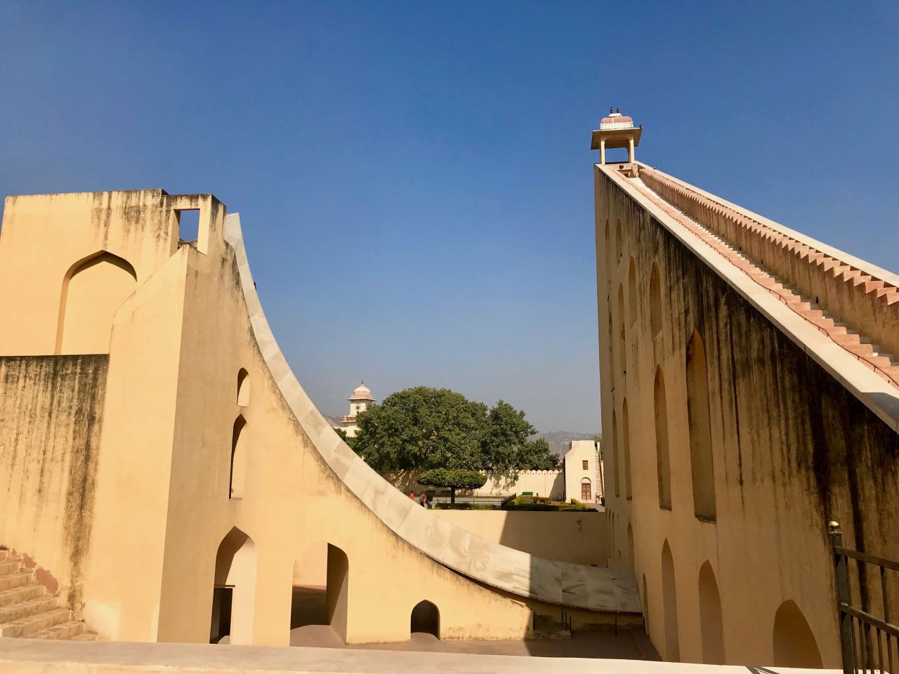 <strong>The Supreme Instrument:</strong> Impossible to miss is the towering Samrat Yantra. Also known as "The Supreme Instrument", the beautiful white marble structure features a 90-foot stairwell that seems to climb toward the heavens. It's one of the world's largest sundials.