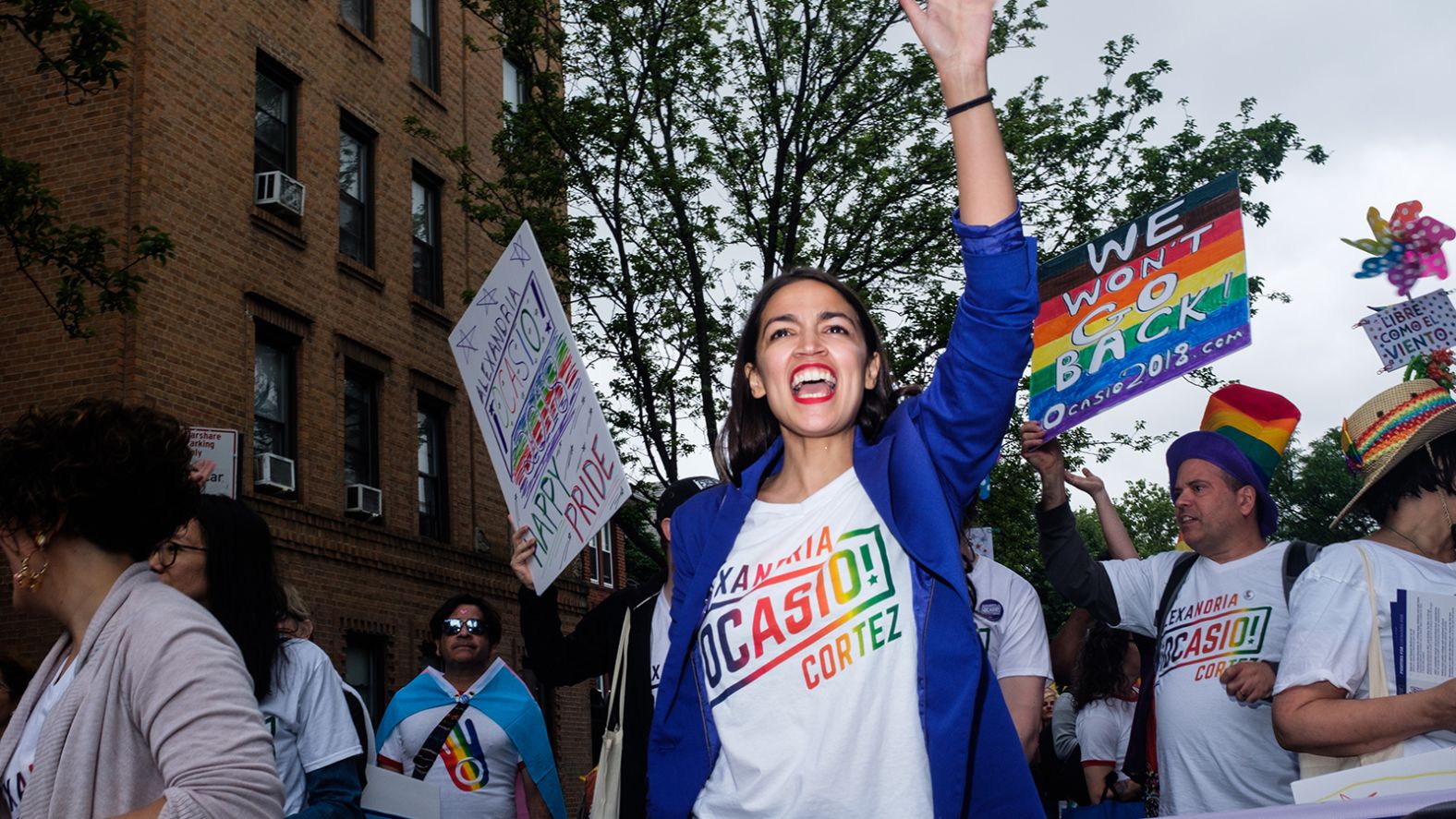 Ocasio-Cortez marches in a Pride parade earlier this month. She was born and raised in the Bronx, the daughter of working-class Puerto Rican parents.