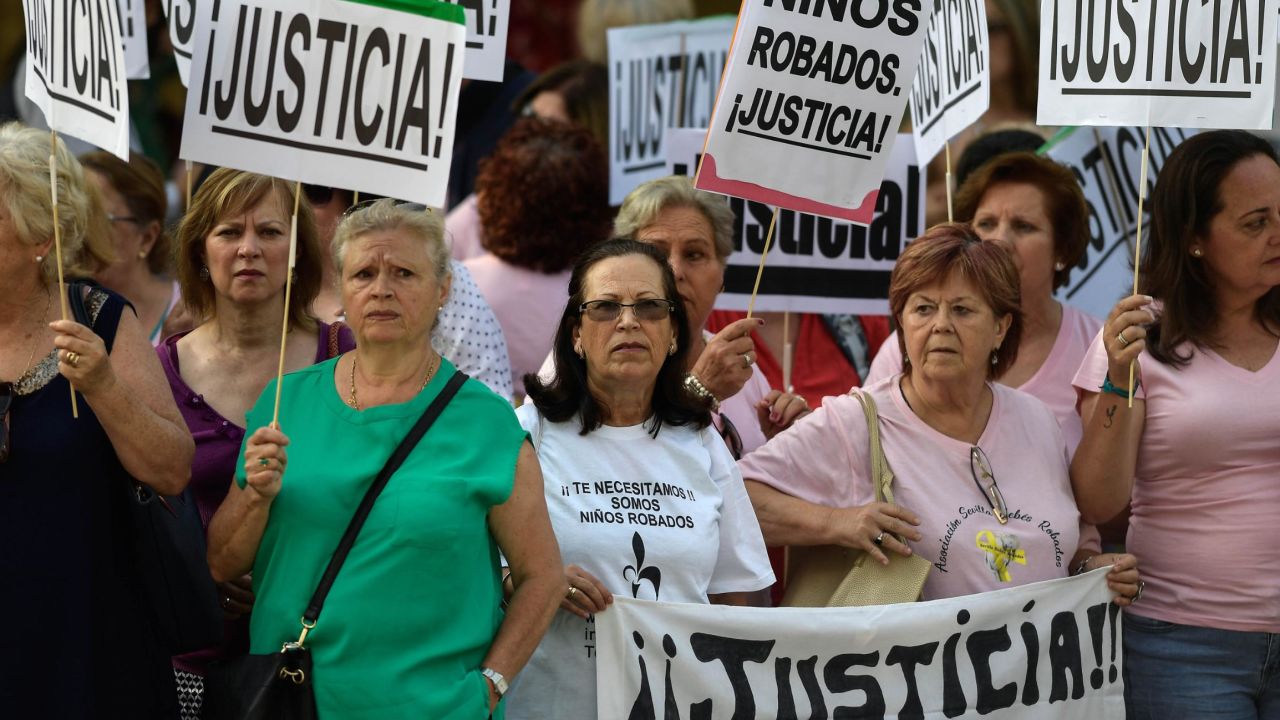 Demonstrators holding placards reading "Justice" outside the court Tuesday.