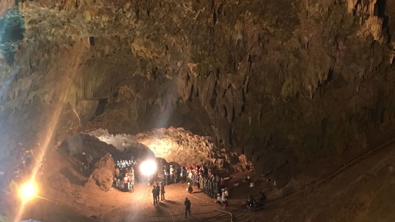 Local volunteers join members of the Thai SEAL team at the entrance to the cave network.
