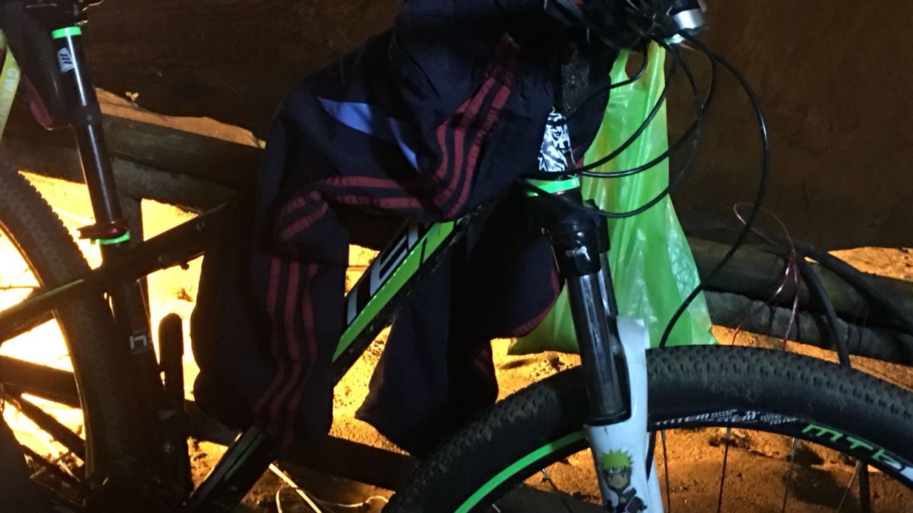 A bicycle belonging to one of the missing boys is seen outside the cave complex.