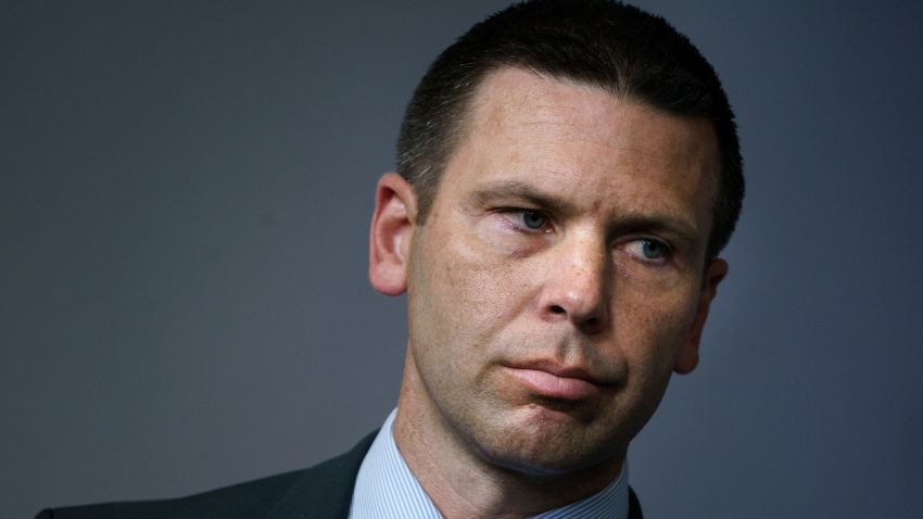 Kevin K. McAleenan (L), Commissioner of US Customs and Border Protection, looks on at a press briefing at the White House in Washington, DC on June 18, 2018. (Photo by Brendan Smialowski / AFP)        (Photo credit should read BRENDAN SMIALOWSKI/AFP/Getty Images)