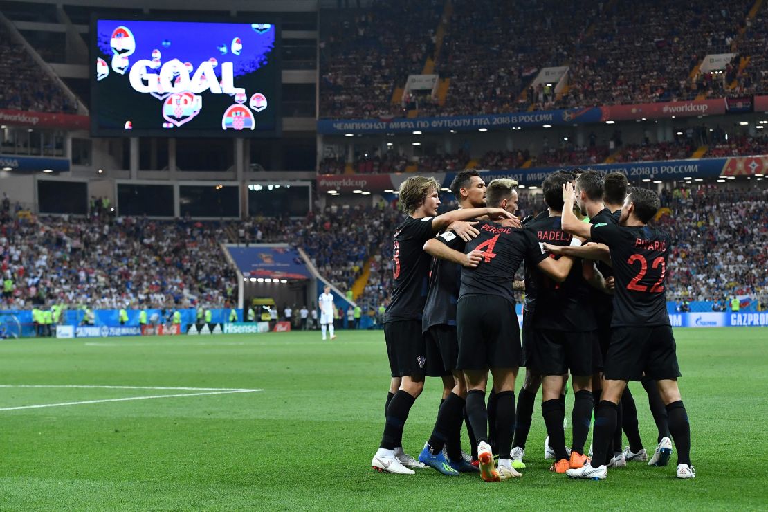 Croatia's forward Ivan Perisic is congratulated by teammates after scoring his team's second goal 