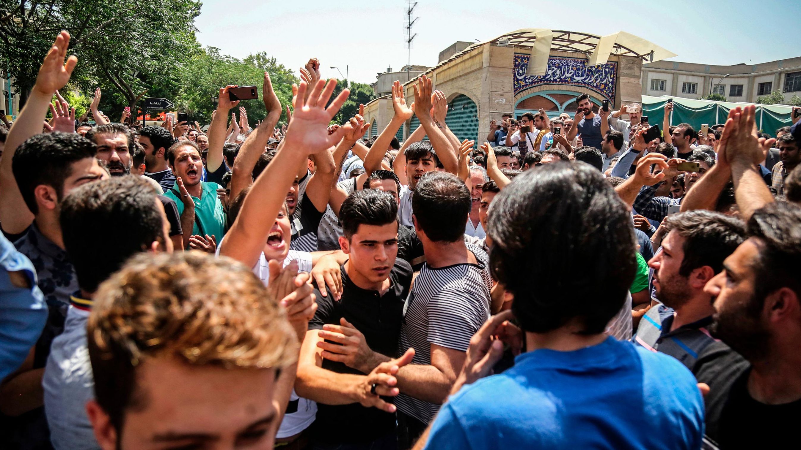 Protesters chant slogans at the main gate of the Grand Bazaar on Monday.