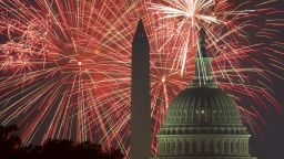TOPSHOT - Fireworks explode over the National Mall as the US Capitol (R) and National Monument are seen on July 4, 2017, in Washington, DC. / AFP PHOTO / PAUL J. RICHARDS        (Photo credit should read PAUL J. RICHARDS/AFP/Getty Images)