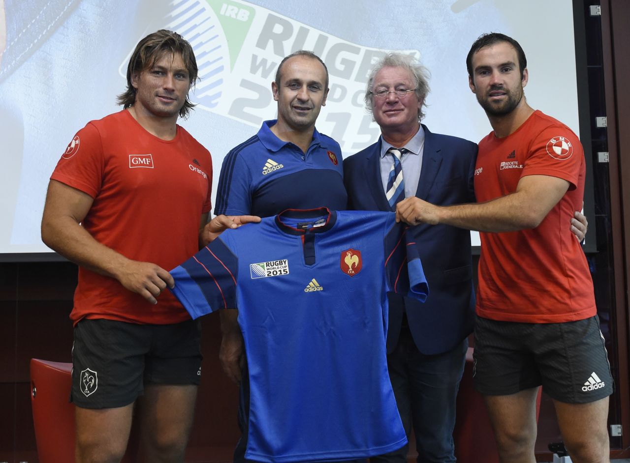 Rives poses with former French coach Philippe Saint-Andre, scrum half Morgan Parra and hooker Dimitri Szarzewski during the presentation of the French jersey ahead of the 2015 World Cup. 