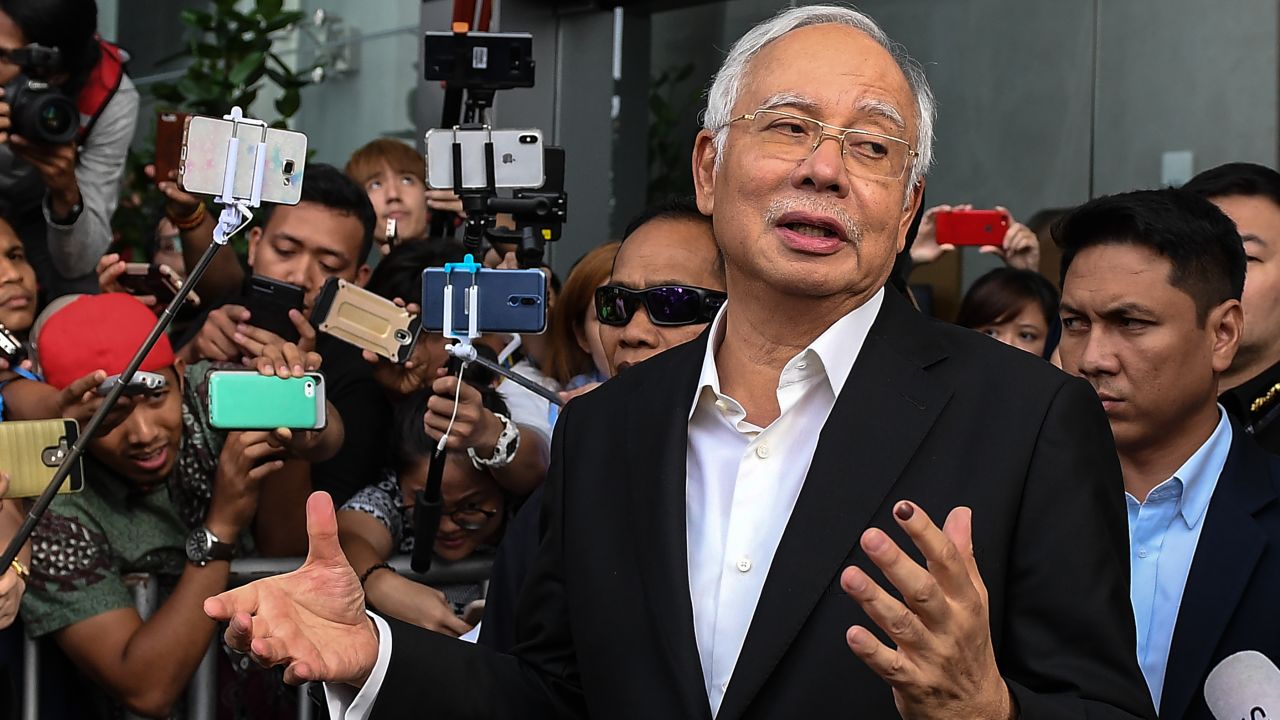 Najib has been banned from leaving the country as police investigate the 1MDB scandal.