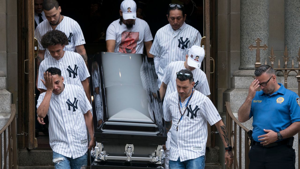 The body of Lesandro Guzman-Feliz, who went by Junior, is taken from the Our Lady of Mount Carmel church after funeral services on June 27, 2018 in New York.