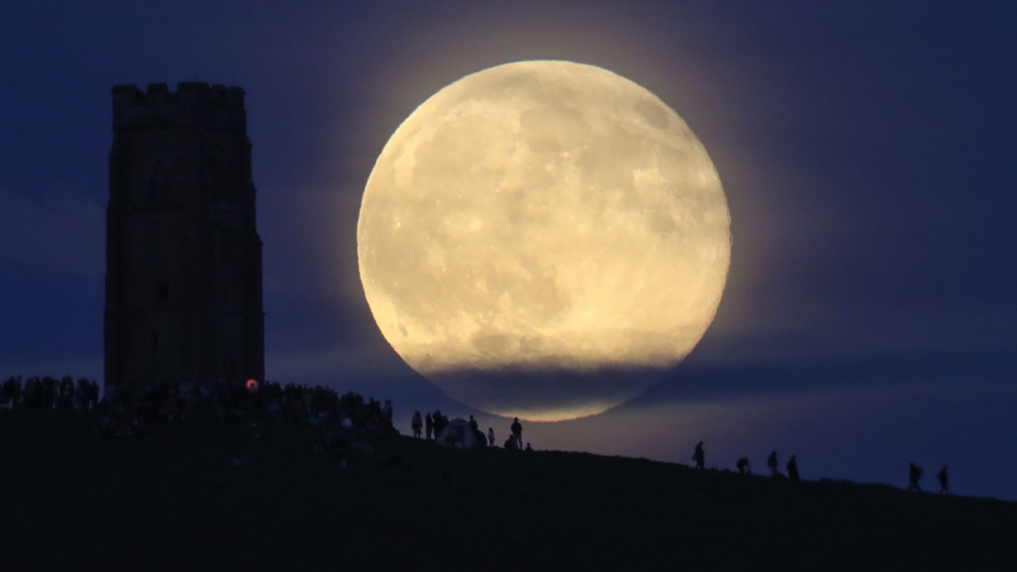 A full strawberry moon rises  in Somerset, England.